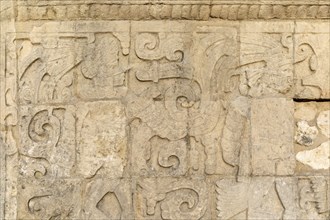 Carved wall stonework Mayan figures, The Ball Court, Juego de Pelota, Chichen Itza, Mayan ruins,