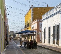 Restaurant tables in historic street of Spanish colonial buildings, Campeche city, Campeche State,