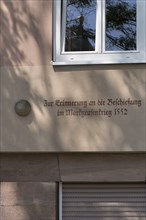 House sign, cannonball from the Margrave's War 1552, Egidienplatz 15, Nuremberg, Middle Franconia,