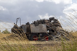 Burnt-out combine harvester, Steinbergkirche, Schleswig-Holstein, Germany, Europe