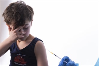 A little boy receives a vaccination, symbol motif