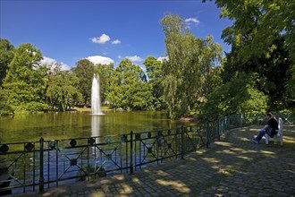 Fountain in the pond, Warmer Damm Landscape Park, Wiesbaden, Hesse, Germany, Europe