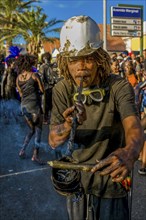 Man with helmet, costumed as constructer. Carnival. Mindelo. Cabo Verde. Africa