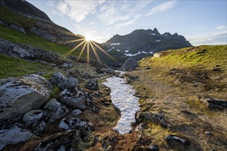 Mountain landscape at sunrise with sun star, Moskenesoya, Lofoten, Nordland, Norway, Europe