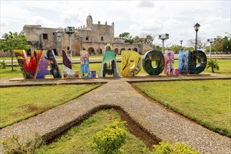 Colourful lettering sign for Valladolid, Yucatan, Mexico in front of Convent of San Bernardino of