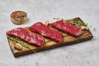 Raw fresh strip steak with spice. Prime beef meat