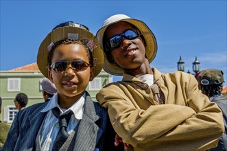 Young men, dressed as businesspeople. Carnival. Mindelo. Cabo Verde. Africa