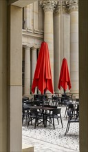 Red parasols in the outdoor area of the restaurant at the Humboldt Forum, Berlin, Germany, Europe