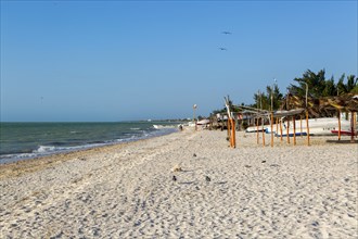 Sandy beach and sea of Gulf of Mexico, coastal fishing settlement of Celestun, Yucatan, Mexico,