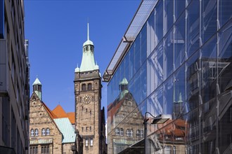 View through Bretgasse to the town hall with the reflection in Galeria Kaufhof