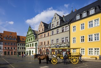 The square was given its distinctive shape in the 16th century by the town house and the