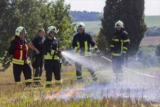 During controlled field fires, the firefighters were able to test various extinguishing methods,