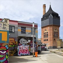 Graffiti at the Schlachthof cultural centre with heritage-protected water tower, subculture,