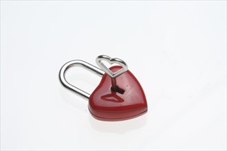 Small red padlock with a heart-shaped key