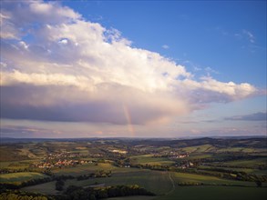 Fields near Babisnau in the evening with rainbow over Kreischa