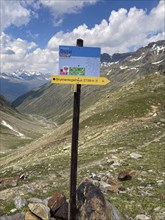 Signpost for hikers trekking hiking trail in Alps alpine high mountains above tree line in Ötztal