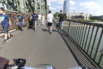 Cycling from a first-person perspective on a shared footpath and cycle path over the Hohenzollern