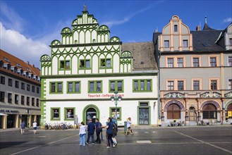 The square was given its distinctive shape in the 16th century by the town house and the