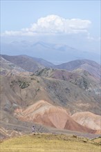 View over eroded mountainous landscape with brown hills, mountains and steppe, Chuy province,