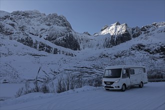 Motorhome and icy mountain scenery, winter, Nusfjord, Lofoten, Norway, Europe