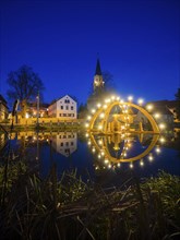 Floating candle arch in the village pond of Bärnsdorf near Moritzburg. The arch is 4.5m high,