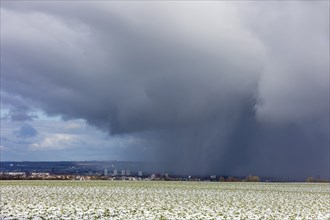 A snow shower moves through the Elbe valley towards the city centre of Dresden