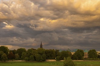 Silhouette of the Old Town of Dresden on the Elbe with storm clouds