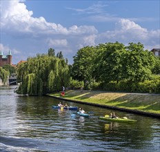 Recreational athlete with canoe on the river Spree in Berlin-Moabit, Germany, Europe