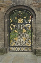 Golden gate with lattice and entrance to the Green Cemetery of St. Mary's Cathedral, wrought iron