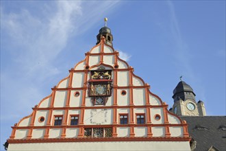 Tail gable with sundial and coat of arms of the Old Town Hall built 1382 and tower of the New Town