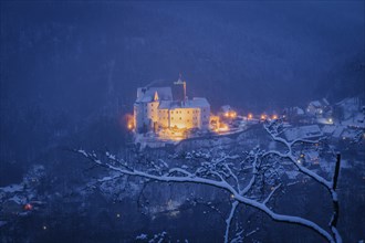 Scharfenstein Castle is a Spornburg on an elongated spur above the village of Scharfenstein