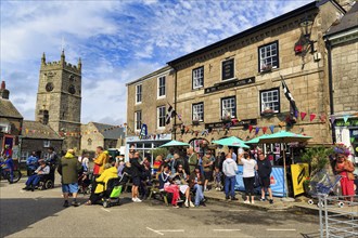 Crowd in town centre, traditional Lafrowda Festival 2023, St Just in Penwith, Cornwall, England,