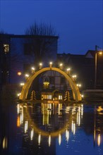 Floating candle arch in the village pond of Bärnsdorf near Moritzburg. The arch is 4.5m high,