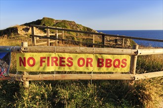 Sign on the railings, No fires or barbecues, Nature conservation, Dorset, England, Great Britain