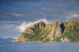 Mountains by the sea, fjord, fishing village Hovden, island Langoya, archipelago Vesteralen,