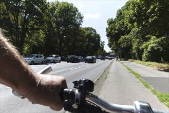 Cycling from a first-person perspective on a cycle path in Cologne, North Rhine-Westphalia,