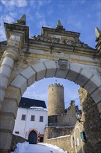 Scharfenstein Castle is a Spornburg on an elongated spur above the village of Scharfenstein