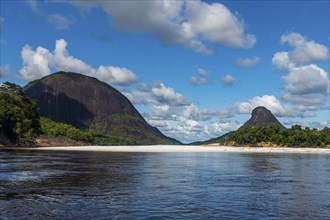 White sand beach before the granite hills of Cerros de Mavecure, Eastern Colombia