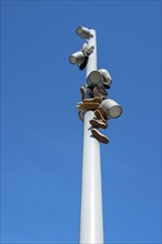 Trainers hanging from a modern light pole, Berlin, Germany, Europe