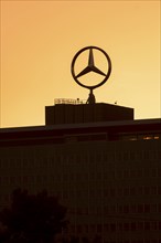 Mercedes star on Mercedes Benz branch in Stuttgart, after sunset, Baden-Württemberg, Germany,