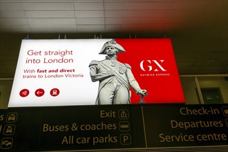 Electronic neon advert for Gatwick Express trains rail service, South Terminal, London Gatwick