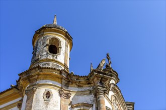 Tower and facade of a historic baroque church in the city of Ouro Preto in Minas Gerais