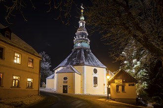 Snow-covered Seiffen with the mountain church