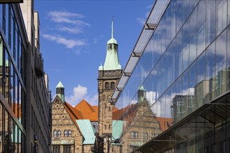 View through Bretgasse to the town hall with the reflection in Galeria Kaufhof