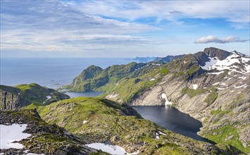 Mountain landscape with steep rocky peaks and lake FJerddalsvatnet and Stuvdalsvatnet, sea view,