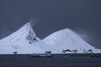 Windswept snow-capped mountains on the island of Mageroya, Honningsvag, Norway, Europe