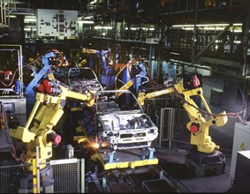 Industry, production, automation of the car industry, worker at conveyor belt, robot, 12 06 1995