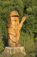 Wood sculpture by chainsaw art, wooden figure, handicraft, wood carving, man, figure, wood, cap,