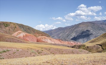 View over eroded mountainous landscape with brown hills, mountains and steppe, Chuy province,