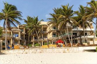 Palm trees and hotel, Playa Secreto beach, Isla Mujeres, Caribbean Coast, Cancun, Quintana Roo,